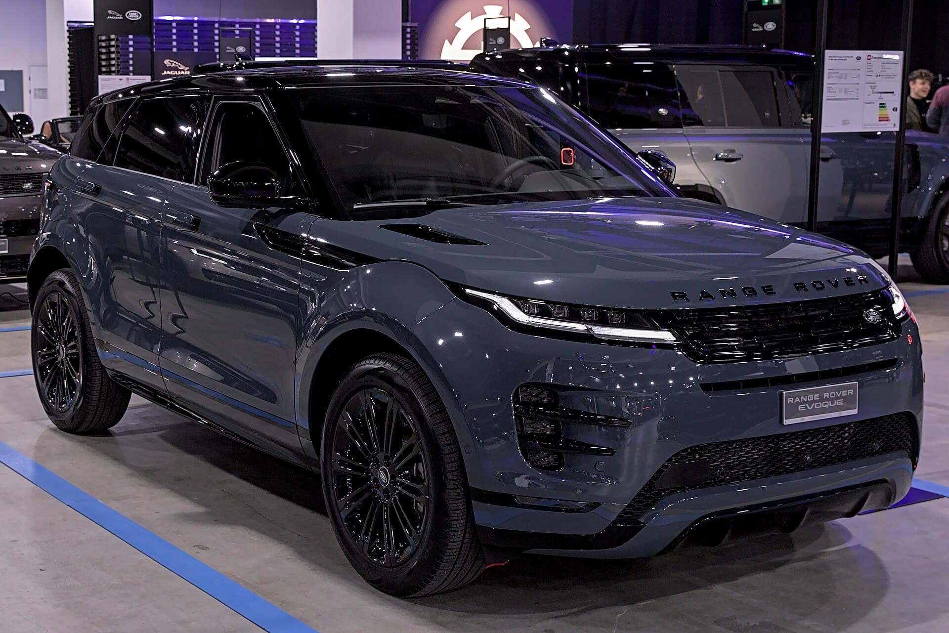 Blue Range Rover Evoque with a model-name display plate