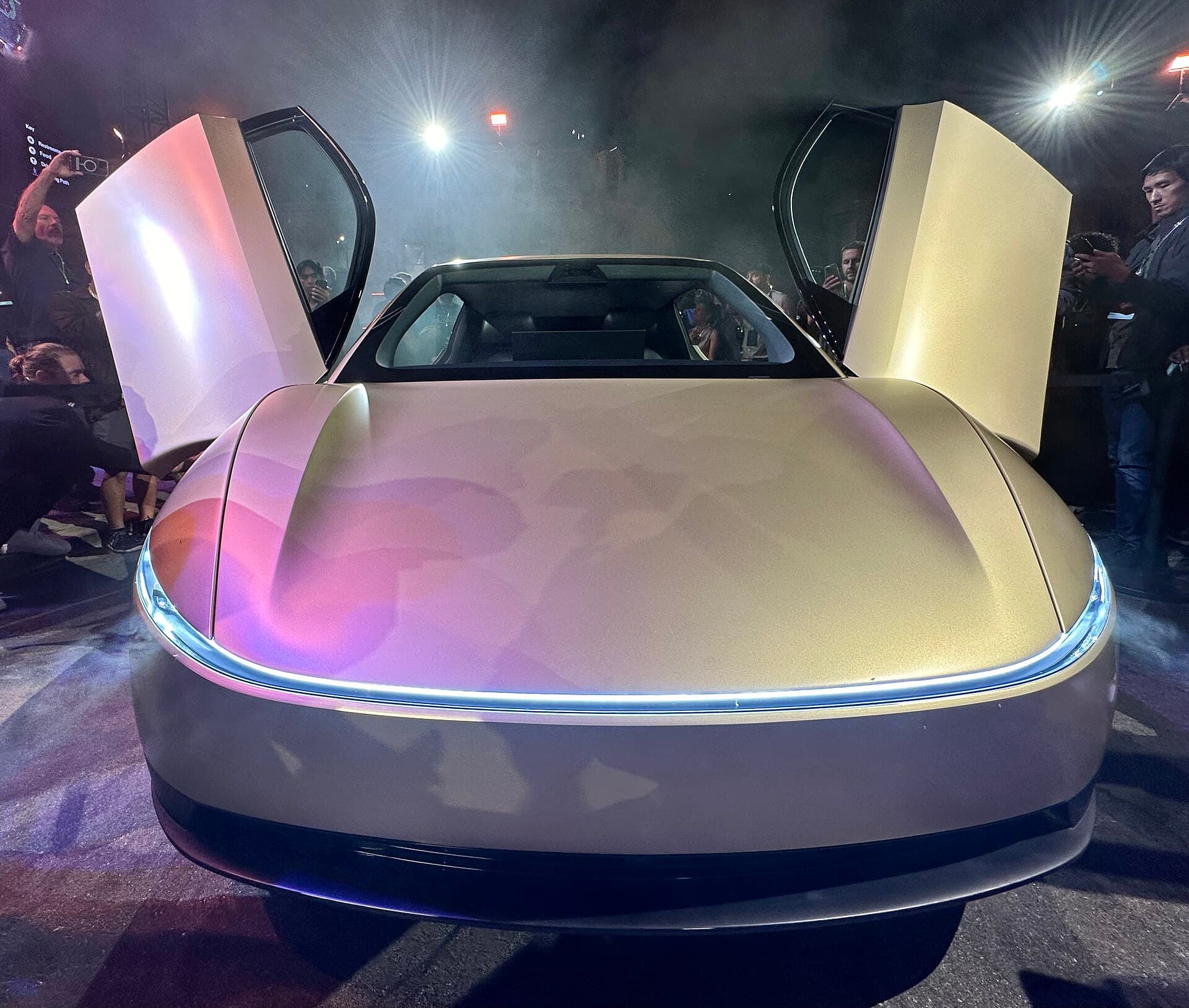 Gold Tesla Cybercab with butterfly doors open